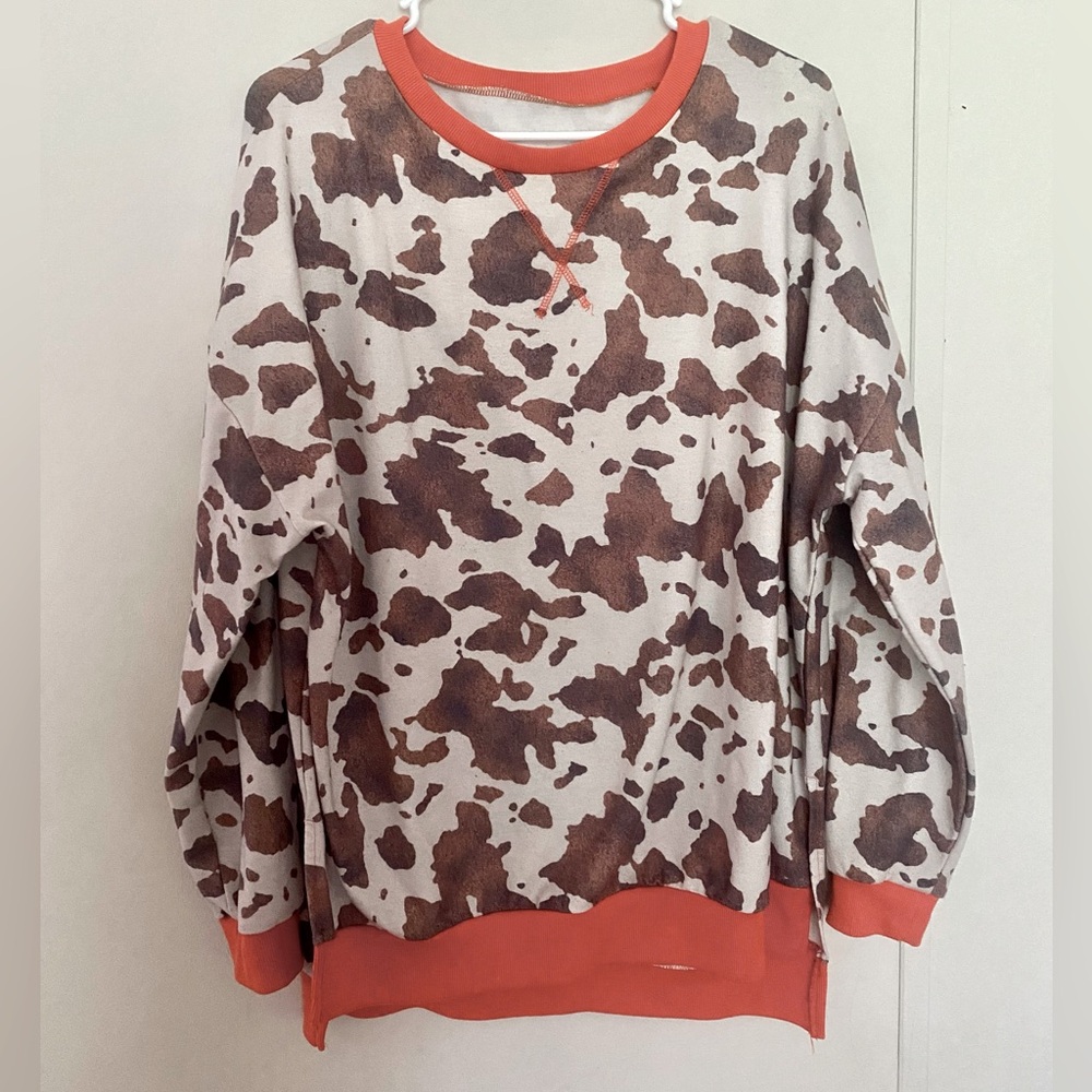Cow Print Sweatshirt with Orange Accents